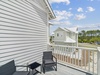 2nd Floor Primary Suite Balcony Offering Seating for Two