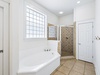 Primary King En-Suite - Soaking Tub + Walk-In Shower