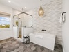 Primary King En-Suite - Oversized Soaking Tub + Walk-In Shower