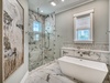 Primary King En-Suite - Featuring a Walk-in Shower and Soaking Tub