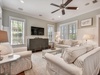 Plush seating, large TV, and seamless flow to the porch for relaxed family time.
