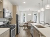 Ample Kitchen Space with Stainless Steel Appliances