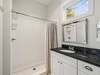Primary King En-Suite - Single Vanity + Walk-In Shower