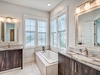 3rd Floor Primary Ensuite - Featuring a Soaking Tub and Dual Vanities