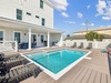 Spend Lazy Days Poolside or Enjoy a Game of Cornhole!