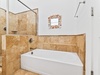 Second Floor ​Primary Ensuite - Featuring a Walk-in Shower and Soaking Tub