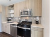 Well Equipped Kitchen with Stainless Steel Appliances