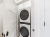 Stack Washer & Dryer Located in the Laundry Area