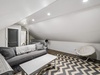 Cozy Seating + Twin Bed for Additional Sleeping Arrangements