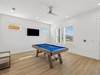 Enjoy a Game of Pool or Catch the Game on the Flat-Screen TV