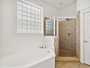 2nd Floor Primary Ensuite - Featuring a Soaking Tub and Walk-in Shower
