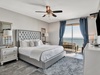 Master Bedroom: Private bath, balcony access, and beach views!