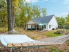 located on a 1.5 acre wooded lot