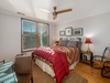 On the second level is the master bedroom with a queen bed.