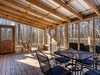 With a screened in porch and a back deck with a hot tub!