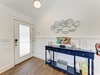 Step through the door into your coastal-inspired entryway, where playful beach décor and charming nautical touches greet you with seaside warmth.