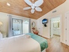 Relax under your warm wood-paneled ceiling with tropical coastal charm and all the comforts you need.