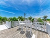 Unwind in your private rooftop retreat with sweeping tropical views, bright blue skies, and cozy seating—perfect for morning coffee or sunset cocktails surrounded by swaying palms and ocean breezes.