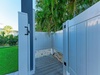 Fresh air meets total privacy in your own outdoor shower oasis, surrounded by swaying palms and tropical greenery.