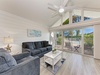 Relax in your bright coastal living room with vaulted ceilings and sliding glass doors opening to your private balcony.