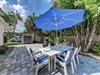 Promise Kept Outdoor Dining Table and Umbrella