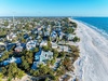 Coastal community with beachfront homes just steps from pristine sandy beaches and crystal-clear waters.