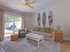 Unwind in your cozy coastal retreat with beachy decor, comfy seating, and access to your private patio with outdoor lounging.