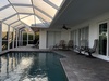 Your private screened pool awaits under a tranquil sunset glow, with loungers perfectly positioned for soaking up peaceful Florida evenings. Slip into refreshing water whenever the mood strikes.