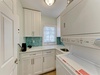 Your laundry day just got an upgrade! This bright space features modern appliances, ample storage, and a cheerful backsplash—making chores feel less like work.