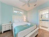Rest peacefully in this serene coastal bedroom where soft turquoise walls and crisp white linens create your perfect seaside sanctuary.