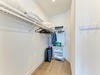 Your walk-in closet offers generous hanging space and organized storage for extended stays.