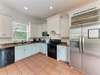 Prepare your favorite meals in this fully equipped kitchen with stainless steel appliances, granite countertops, and plenty of cabinet space for all your culinary needs.