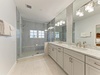 Indulge in your private spa-like retreat with a spacious walk-in shower, dual vanities, and elegant marble finishes that make every morning feel luxurious.