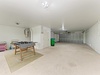 Spacious garage with convenient parking and game table setup—perfect for your vehicles and friendly foosball matches during your stay.