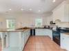 Gather in this spacious kitchen, where granite countertops and stainless appliances set the stage for your culinary adventures. Plenty of cabinet space and a large island make meal prep feel effortless.