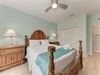 Sink into soft linens and tropical breezes in your serene coastal retreat, complete with elegant carved wood furnishings and soothing seaside hues.