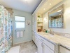 Refresh in your coastal-inspired bathroom with a spacious vanity, soothing ocean hues, and plenty of natural light to start your day feeling relaxed.