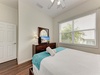Drift off in your serene bedroom with vaulted ceilings, crisp linens, and natural light filtering through the blinds. A peaceful haven awaits your arrival.