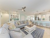 Your spacious open living area flows seamlessly into a bright kitchen, complete with a breakfast bar perfect for morning coffee and casual meals together.