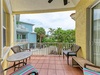 Step onto your private balcony and breathe in the tropical Florida air. Wicker seating invites you to unwind with morning coffee or evening cocktails, surrounded by lush palm trees and coastal charm.