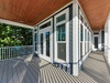 Spacious wrap-around porch with beautiful wood ceiling where you'll enjoy morning coffee and evening relaxation.