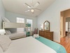 Relax in your coastal bedroom where bunk beds and a queen bed provide flexible sleeping for the whole family.