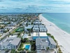 Beachfront property complex offering direct access to pristine white sand beach and crystal-clear waters.