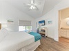 Drift off in your coastal-inspired bedroom, where vaulted ceilings, crisp linens, and beachy decor create the perfect sanctuary for restful nights and lazy mornings.