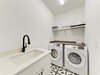 Your private laundry room features modern appliances and a convenient utility sink, making it easy to keep your clothes fresh during your stay.