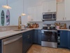 Prepare fresh coastal meals in your stylish, fully-equipped kitchen featuring stainless steel appliances, ample counter space, and charming surf-inspired accents that set a relaxed, beachy tone.