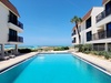 Water's Edge 204S Condo Pool and Beach View