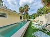 Your private pool oasis awaits with crystal-clear waters and comfortable loungers surrounded by lush tropical palms for ultimate relaxation.