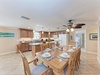 Gather around your spacious dining table for memorable meals with family and friends in this open-concept kitchen area.