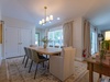 Gather around this inviting dining table where your group can share meals, stories, and laughter together in a bright, naturally lit space designed for memorable moments.